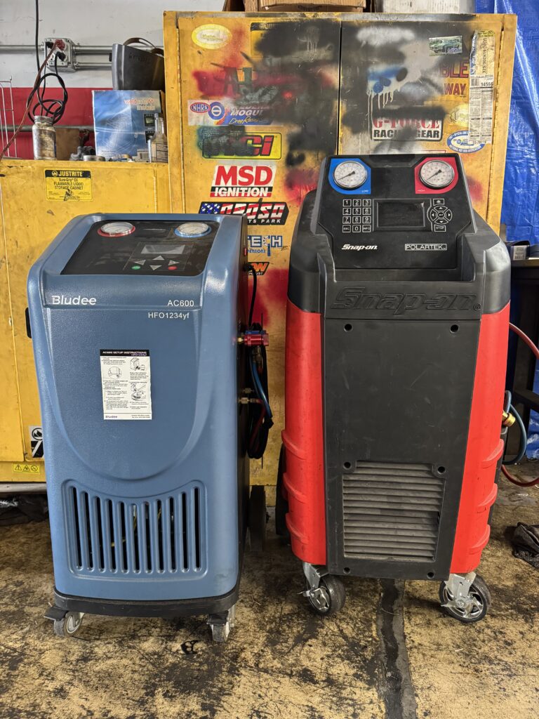 A/C diagnosis and repair equipment at Auto Trans M.D. transmission shop in West Palm Beach